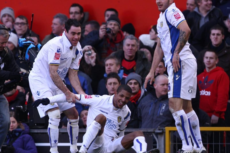 Andy Hughes helps Jermine Beckford get back up in his feet during the FA Cup third round clash against Mancester United at Old Trafford in January 2010.