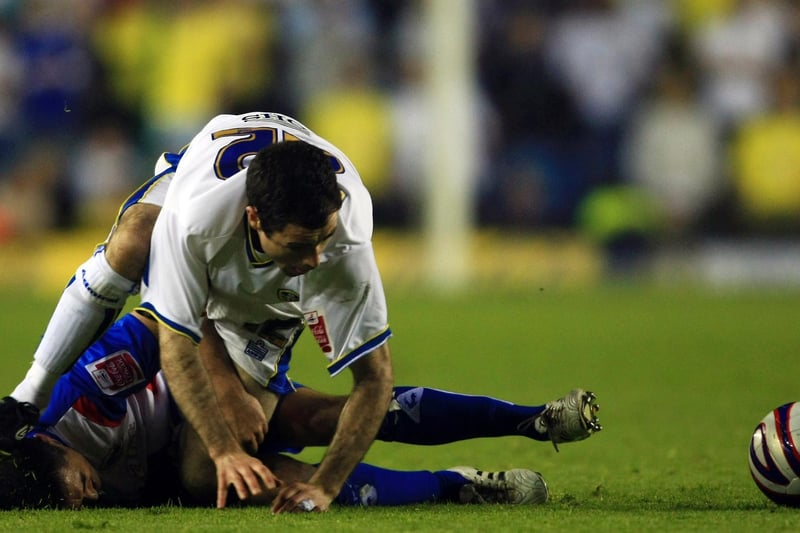 Andy Hughes gets in a tangle with Carlisle United's Evan Horwood during the League 1 play-off semi-final first leg at Elland Road in May 2008.