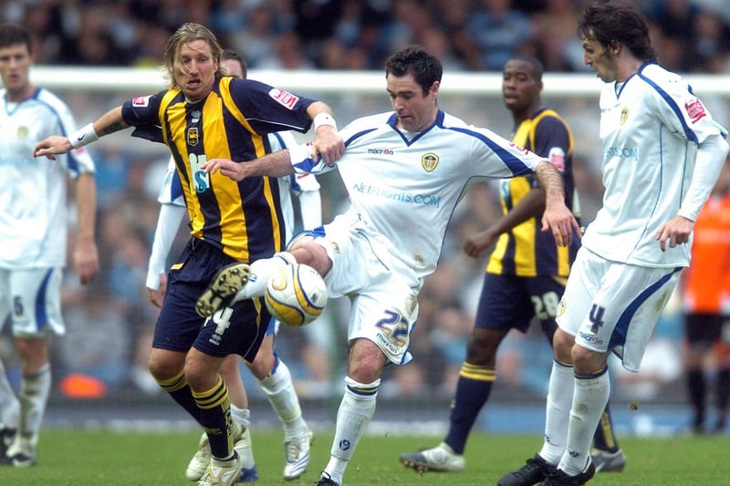 Andy Hughes gets the better of Brighton & Hove Albion's Robbie Savage during the clash at Elland Road in October 2008.