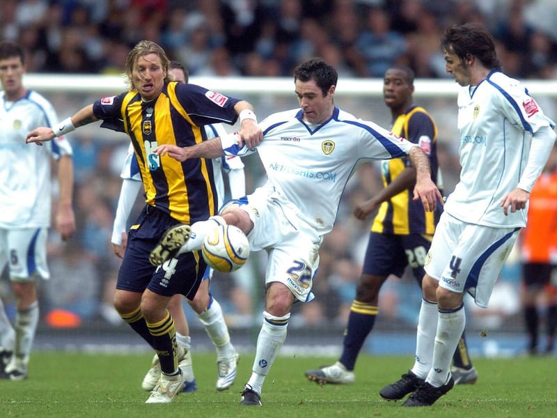 Andy Hughes gets the better of Brighton & Hove Albion's Robbie Savage during the clash at Elland Road in October 2008.