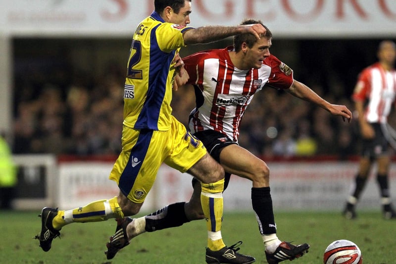 Andy Hughes hunts down Brentford's Ryan Dickson during the League One clash at Griffin Park in December 2009.