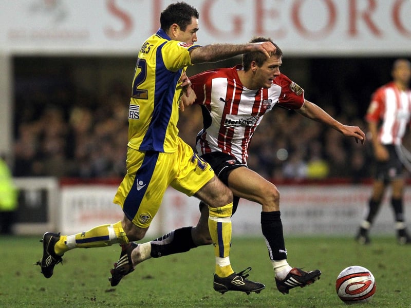 Andy Hughes hunts down Brentford's Ryan Dickson during the League One clash at Griffin Park in December 2009.