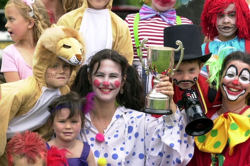 Parent Lydia Holder with the trophy for the best float won by West End Primary and Nursery School in June 2003.