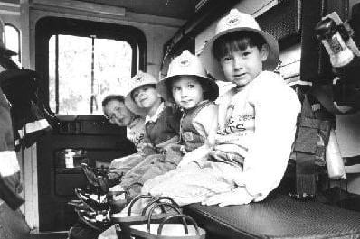 Children sat in the cab of a fire engine at Pontefract fire station open day
