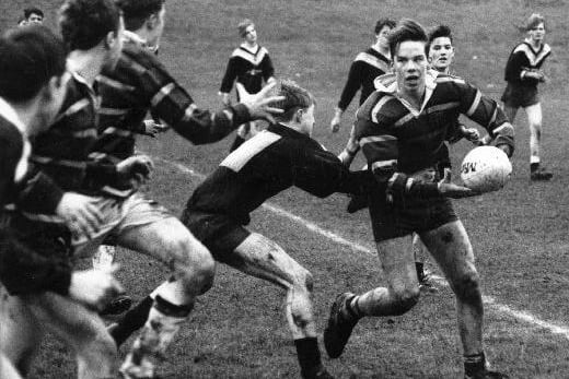 A press photograph of the Castleford High School rugby team in action