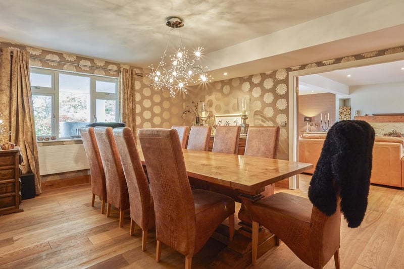A contemporary chandelier adds a lttle sparkle to the dining room