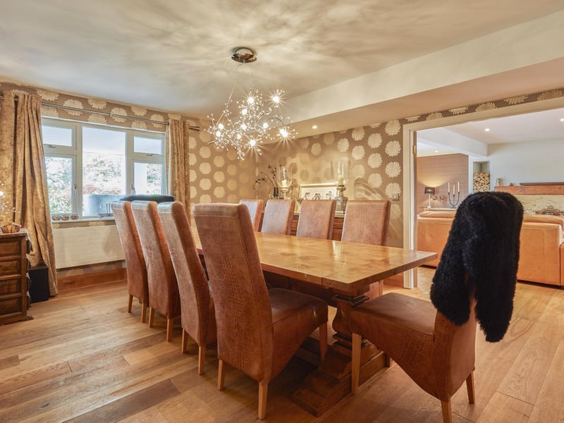 A contemporary chandelier adds a lttle sparkle to the dining room