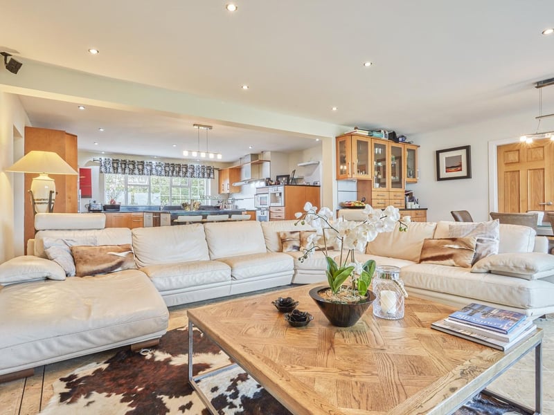 The open plan kitchen/sittiing and dining area