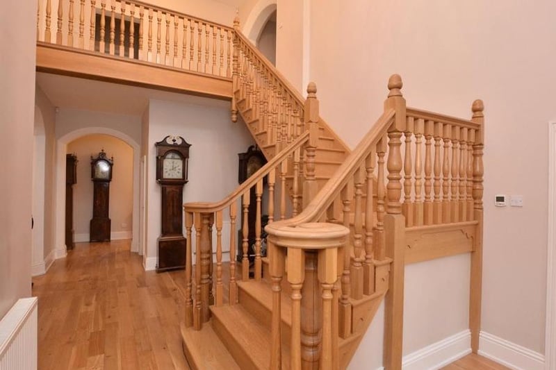 The Old Vicarage is entered via a welcoming double height reception hallway with oak flooring and doors leading to all the main reception rooms. This room has been modernised but still retains the old archways and grandfather locks.