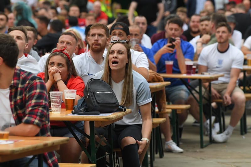 Fans watching the England v Scotland match at Flag Market Fans Zone