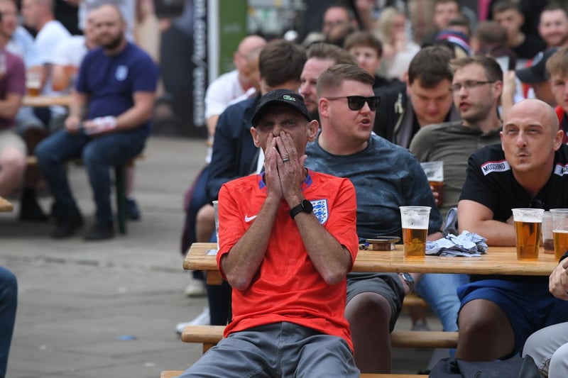 Fans watching the England v Scotland match at Flag Market Fans Zone