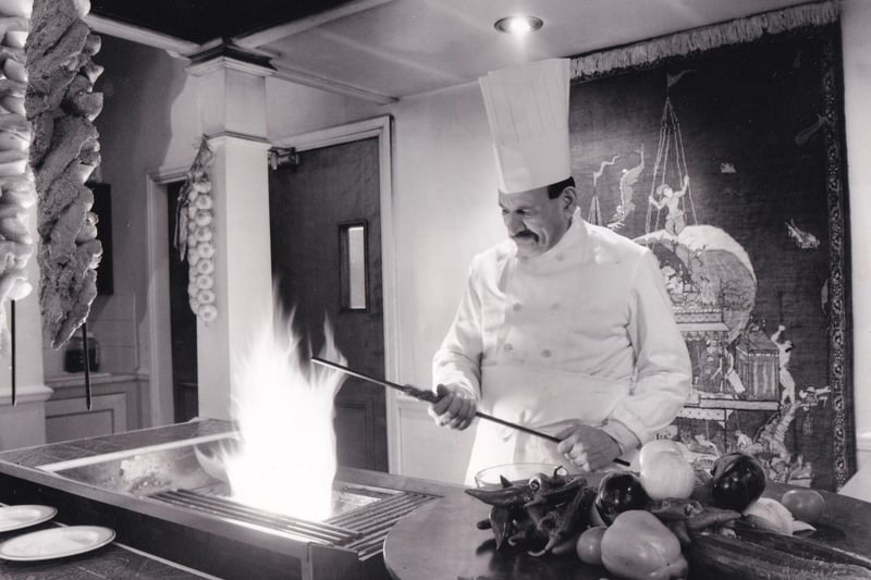 Karim Mir, the owner of Darbar on Kirkgate, prepares a dish in February 1994.