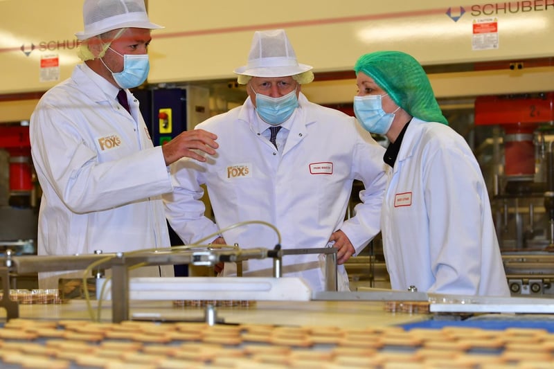 The PM and Coun Stephenson meet with staff on a visit to the Fox's Biscuits factory in Batley. Photo by Mike Simmonds