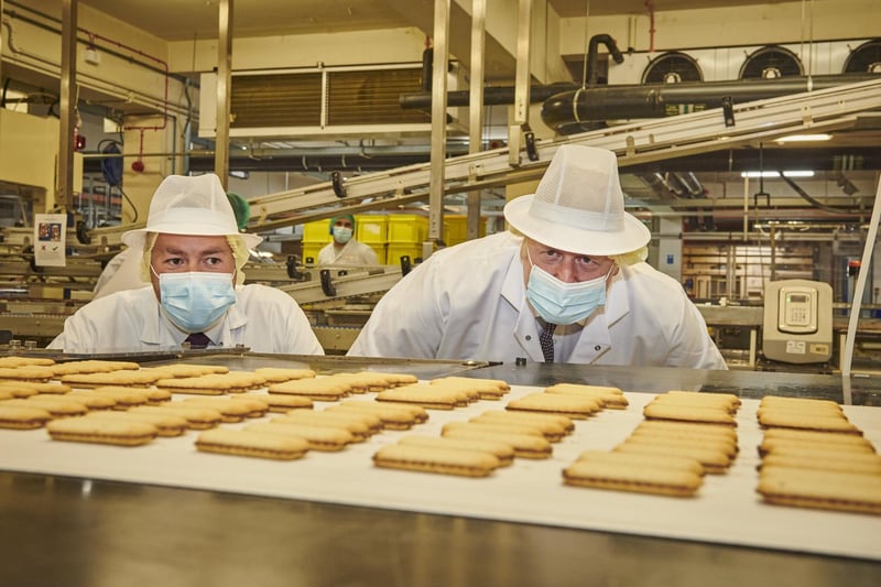 Mr Johnson takes a closer look at some of the biscuits. Photo by Joel Anderson