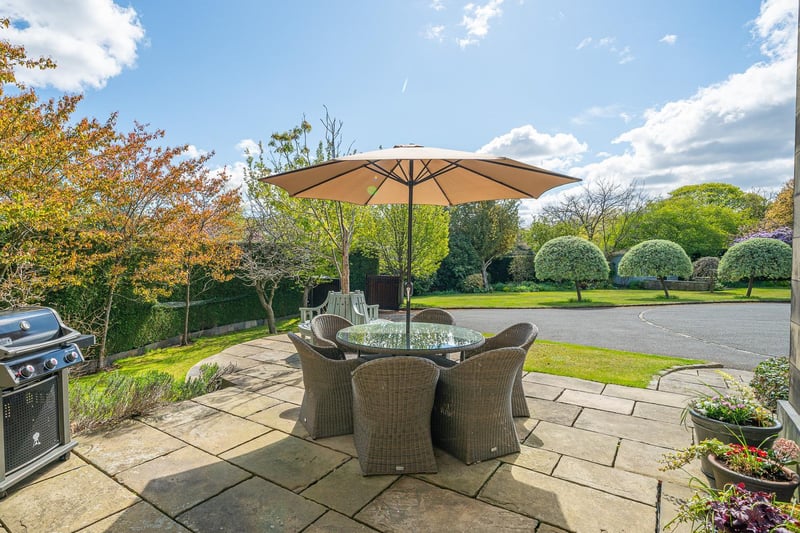 Enjoy al fresco dining or sitting out in the sun on this flagged patio within the grounds