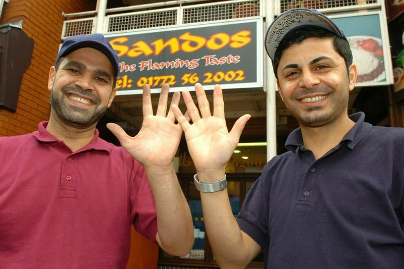 High fives ... Salah Hassan and Roj Khwaz of Sando's are delighted that they have recently been re-assessed and improved their hygiene scores to five stars