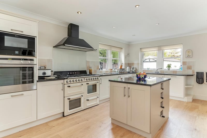 The recently renovated breakfast kitchen with central island, integrated appliances and a Smeg Range Cooker and stove.