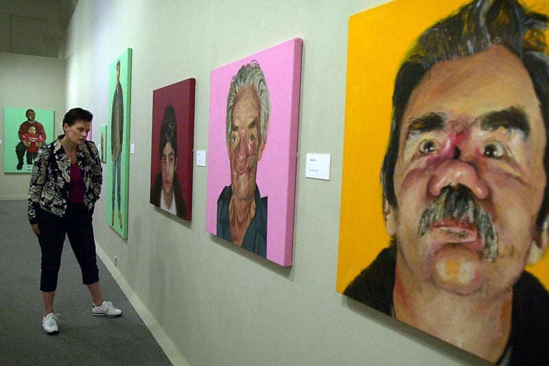Maria Perstedt looks at some of the exhibits at the Saving Faces exhibition by portraitist Mark Gilbert which was being held at Leeds Art Gallery.
