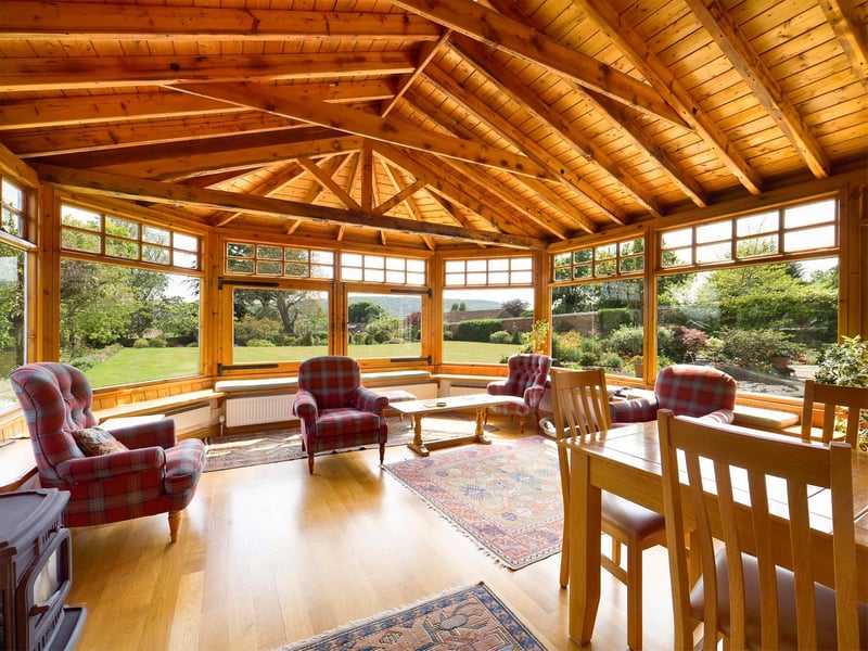 Gardens surround the house conservatory