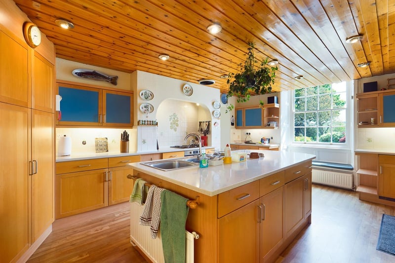 Wood and windows make the kitchen bright and welcoming