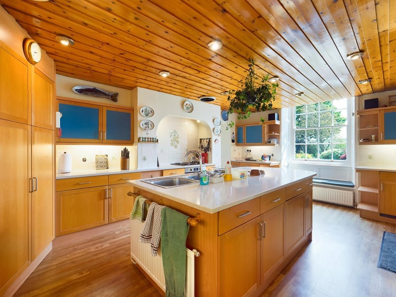 Wood and windows make the kitchen bright and welcoming