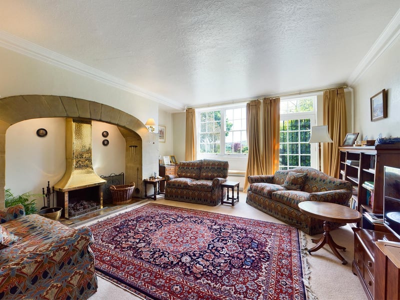 The fireplace is a focal point of this reception room within the house