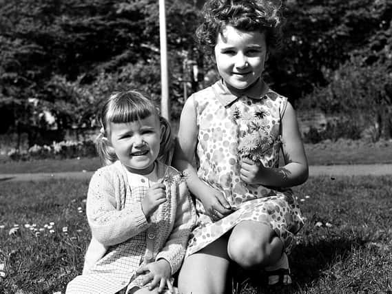 Sisters Alison and Katherine Walmsley enjoy one of Wigan's well kept parks in May 1970