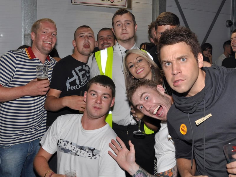 Group of revellers in the smoking area.