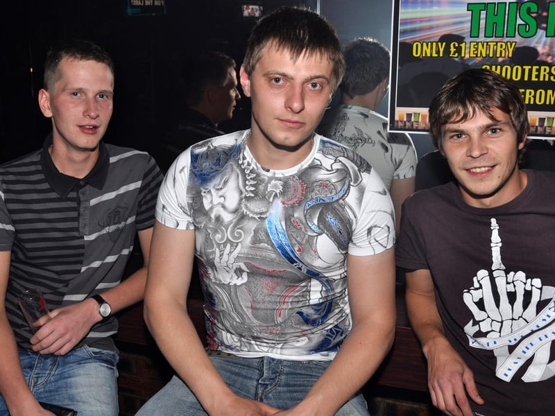 Valdas, Lee and Simas grab a stool.
