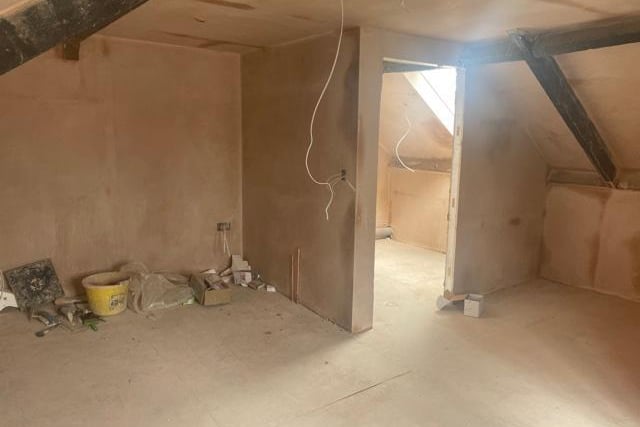 A bedroom in one of the flats which has now been plastered.
