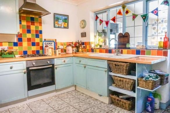 The kitchen is another bright and cheerful place, with fitted appliances and plenty of storage room for hungry families.