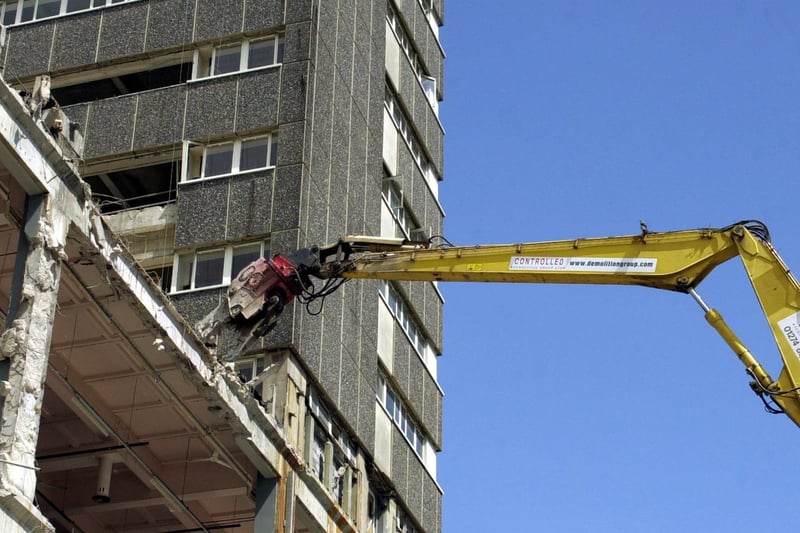 A mechanical claw reaches up the side of the old Royal Mail Building on Whitehall Road during demolition.