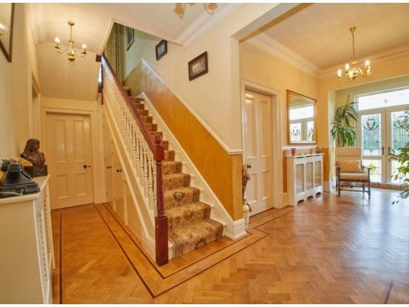 Enter into the beautiful, warm and spacious hallway. The cosy space benefits from glass doors into the garden, the main staircase and has enough room to sit and relax. There is also a handy W.C in this area.