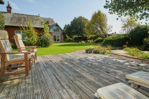 The garden boasts a charming decking area perfect for relaxing with friends and family and enjoying the peaceful location.