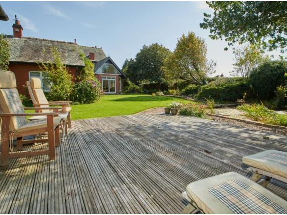 The garden boasts a charming decking area perfect for relaxing with friends and family and enjoying the peaceful location.