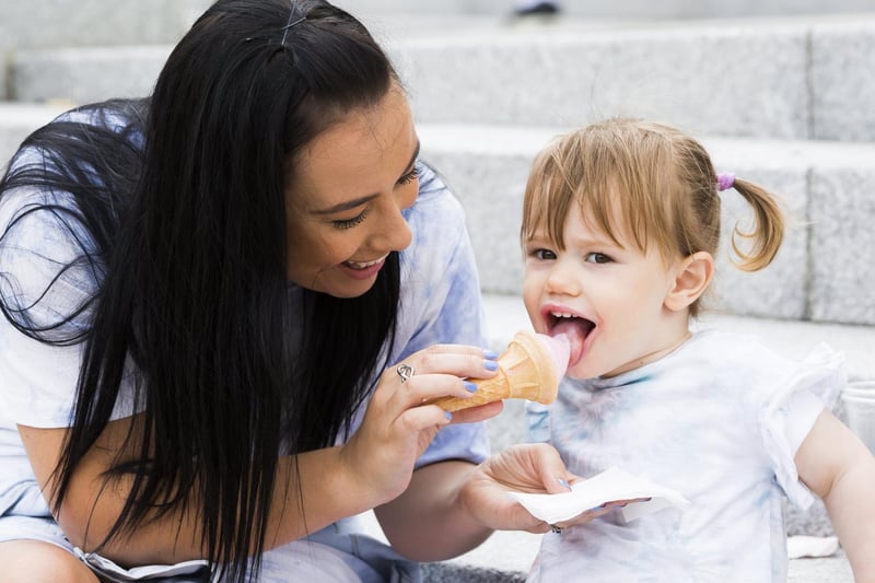 One-year-old Elle Tagg enjoying some icecream with mum Izzy Tagg.
