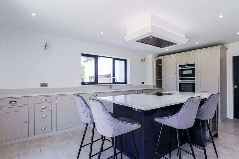 There is plenty of space for dining table and chairs within the modern kitchen