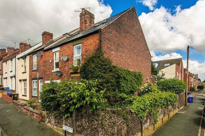 The three-bedroom terraced house, which also features a spectacular handcrafted fence doubling up as a giant bug house, is on the market with an asking price of £240,000.