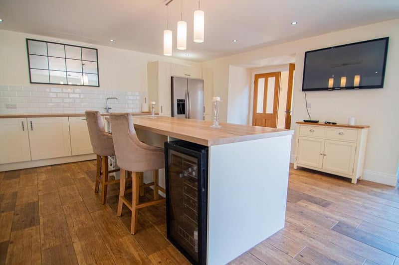 The George Moore designer kitchen features and American style fridge/freezer, wine fridge and an integrated dishwasher, as well asa large gas cooker and oven.