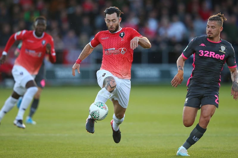 Kalvin Phillips hunts down Salford City's Richie Towell.