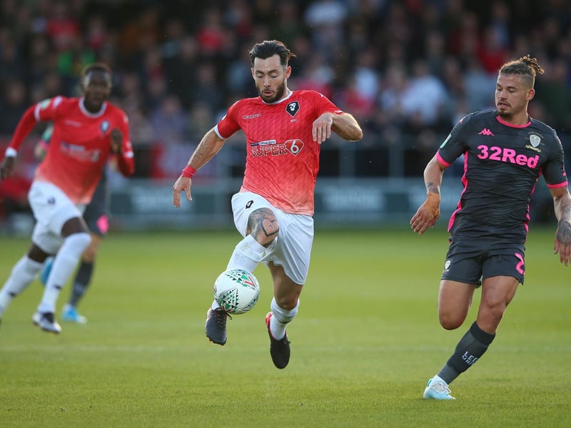 Kalvin Phillips hunts down Salford City's Richie Towell.