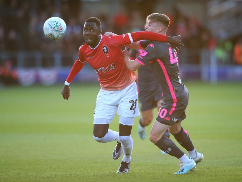 Salford City's Mani Dieseruvwe gets the better of Leif Davis.
