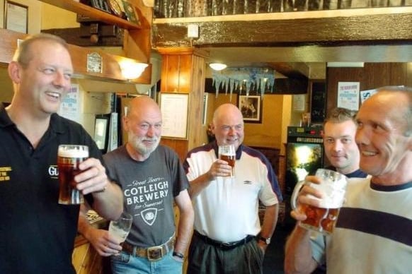 Landlord Neil Weaver, left, drinking with some of his regulars at the Robin Hood pub at Pontefract, where the Pontefract Beer Festival was held in 2004