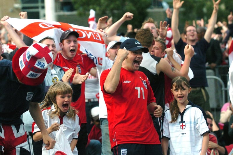 Fans celebrate after Wayne Rooney doubled England's lead.
