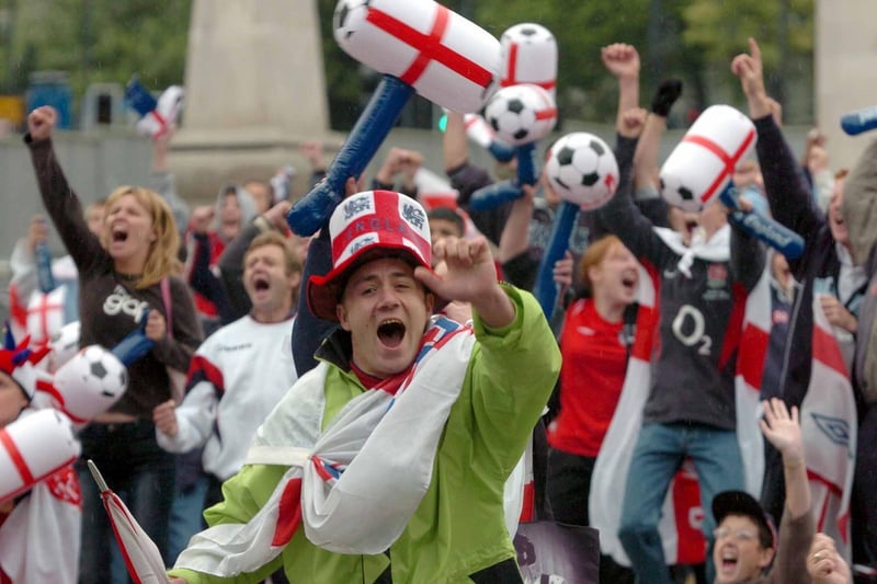 Another photo of England fans in Millennium Square celebrating Michael Owen's early goal against Portugal.