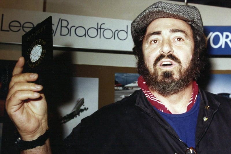 Italian operatic tenor Luciano Pavarotti is pictured with a Yorkshire passport he was given on his arrival at Leeds and Bradford Airport in June 1992.