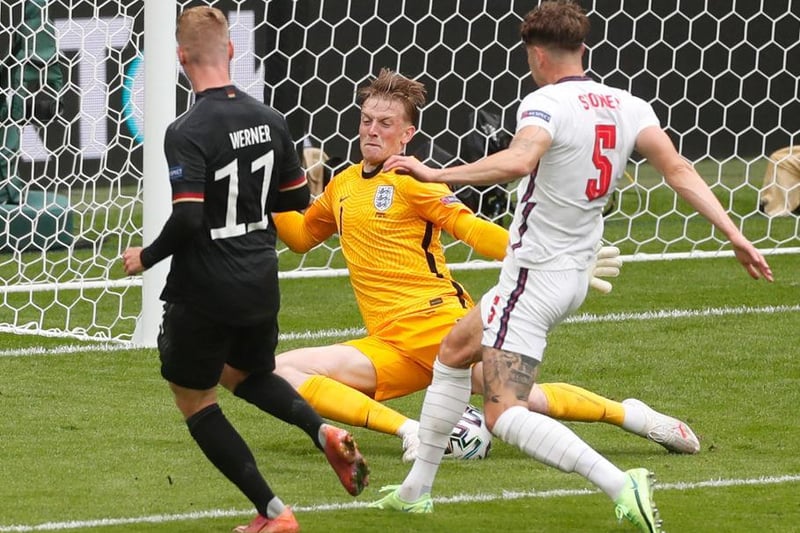 .England's goalkeeper Jordan Pickford saves a shot by Germany's forward Timo Werner