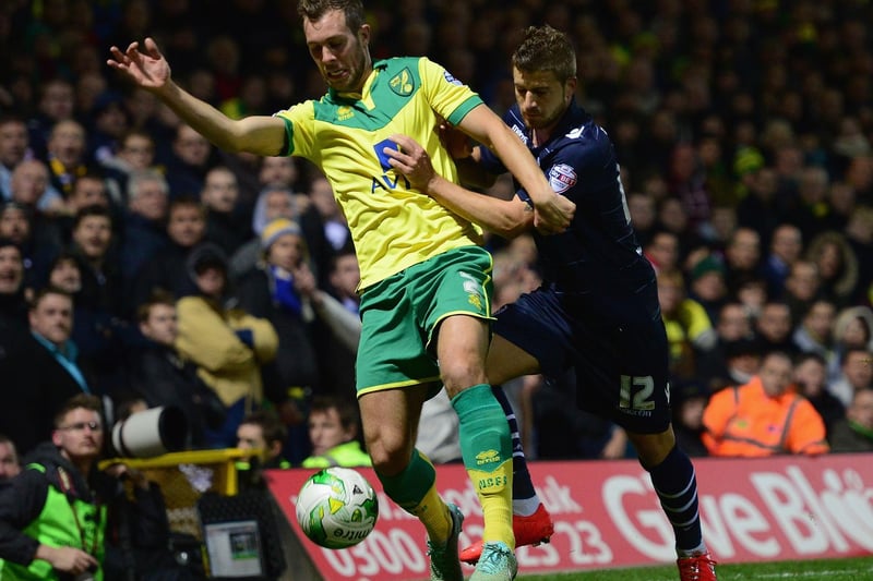 Gaetano Berardi battles with Norwich City's Steven Whittaker during the Championship clash at Carrow Road in October 2014.