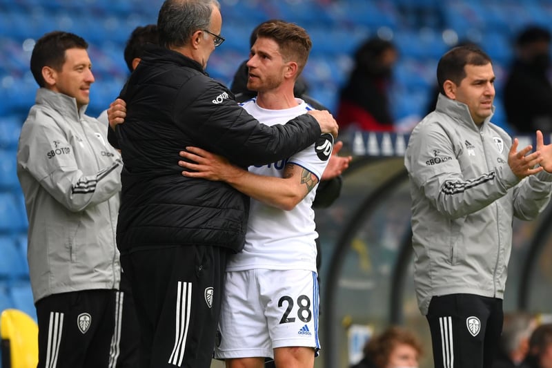Gaetano Berardi is embraced by manager Marcelo Bielsa after he leaves the pitch after his last match for Leeds United during the Premier League clash against West Bromwich Albion at Elland Road in May 2021.