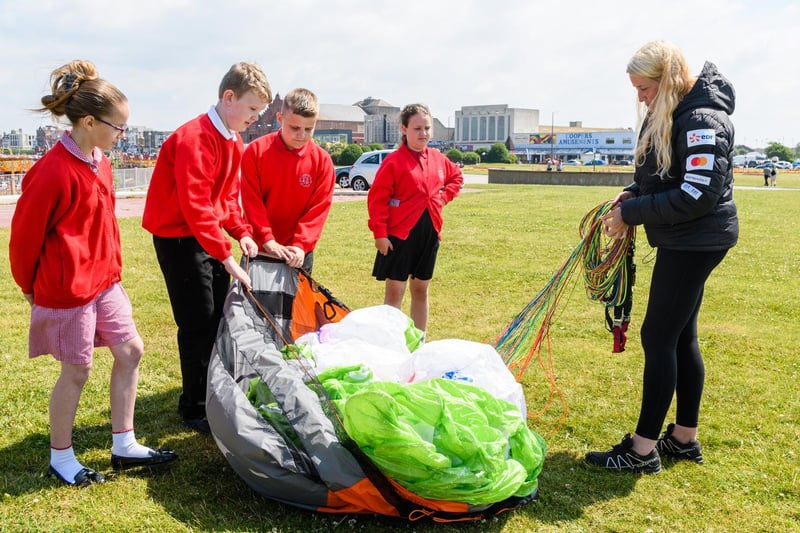 Sacha Dench shows pupils from Ryelands Primary School how her paramotor works. Photo: Kelvin Stuttard